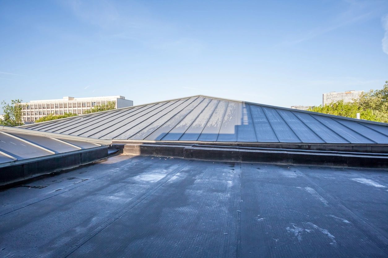 The Hidden Dangers of Wet Weather on a Damaged Flat Roof